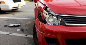 Damaged red car from a front-end collision
